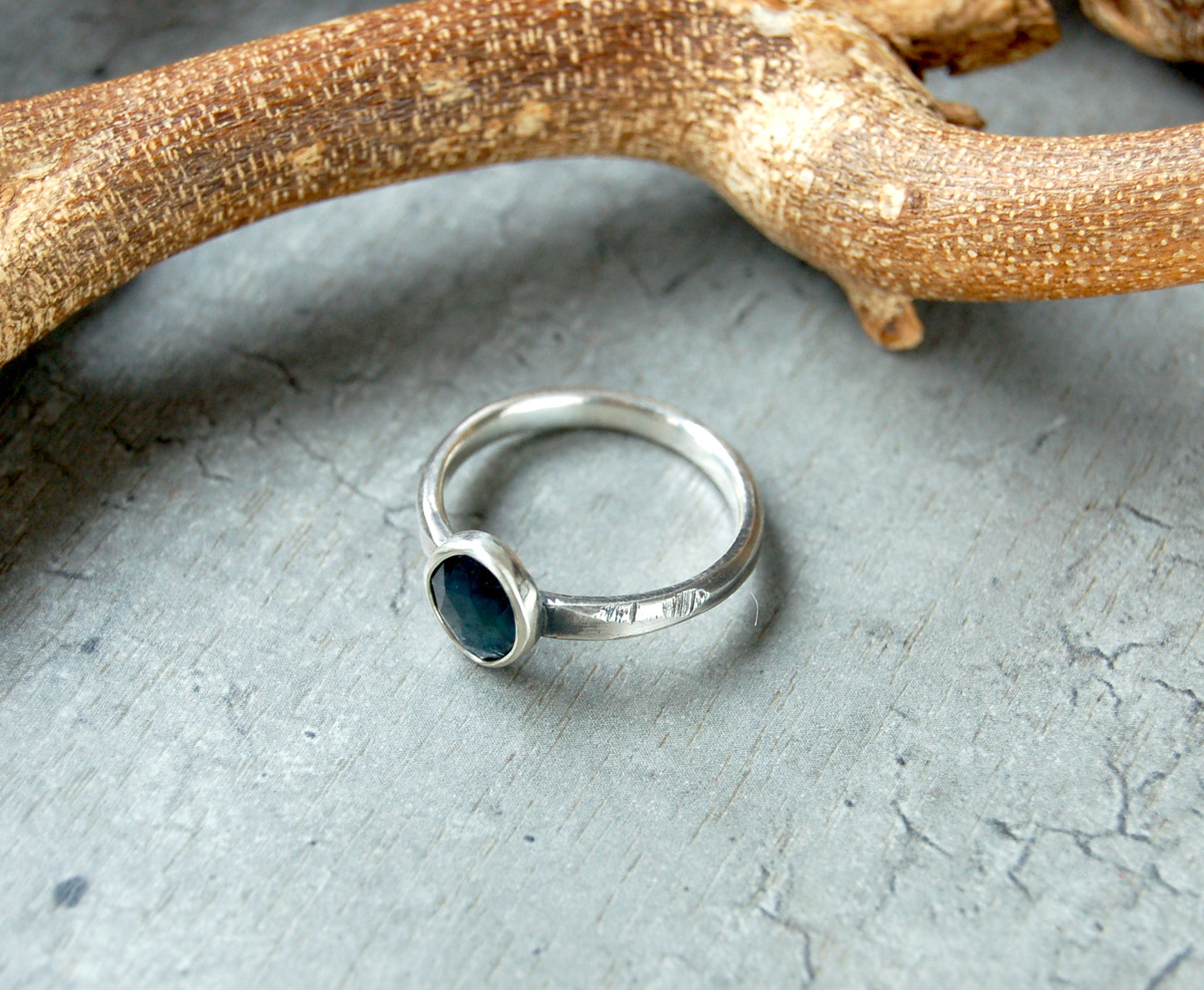 Avant Garde Style ring with Teal Blue Sapphire in Sterling Silver