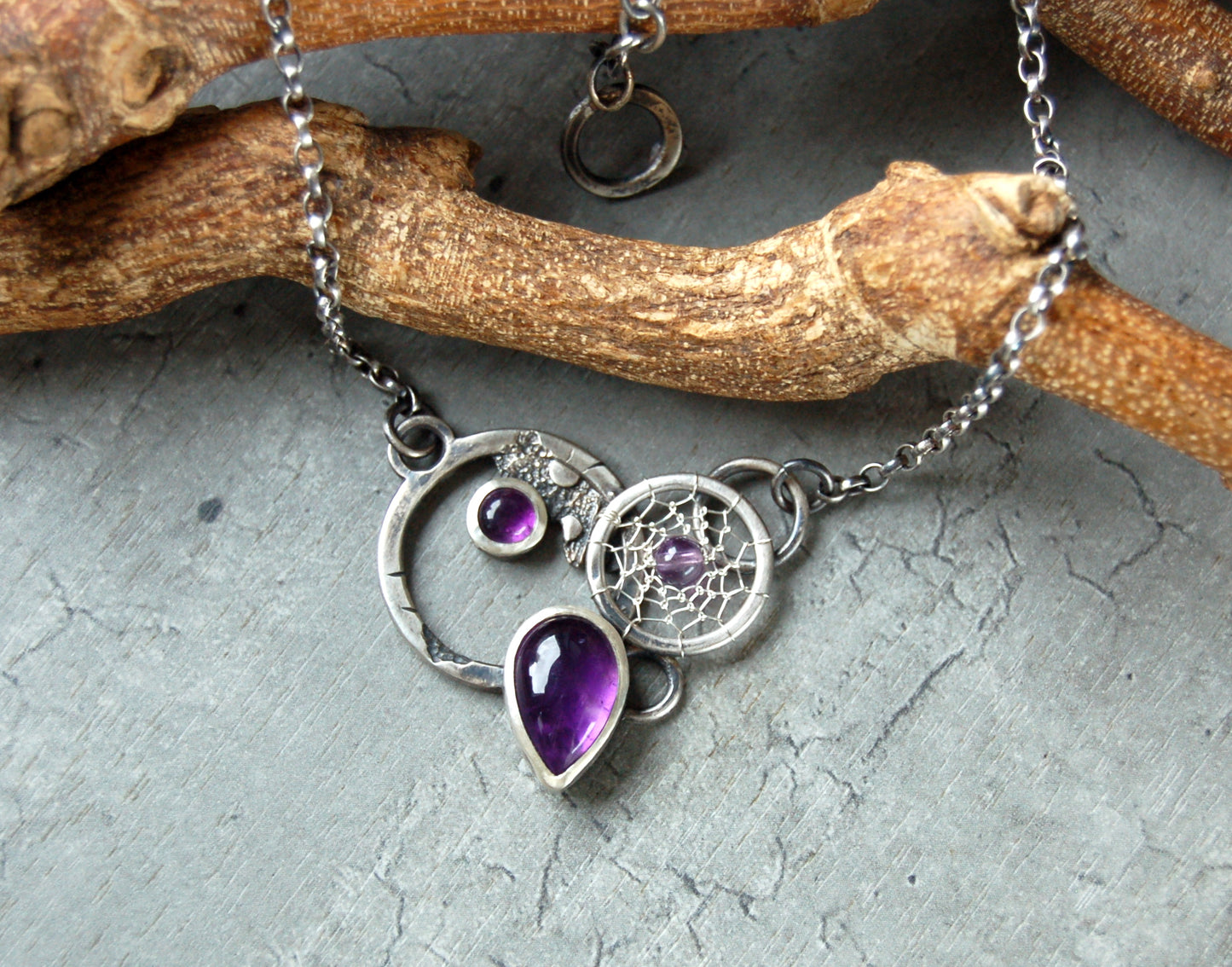 Textured silver pendant with Amethyst crystals and dreamcatchers