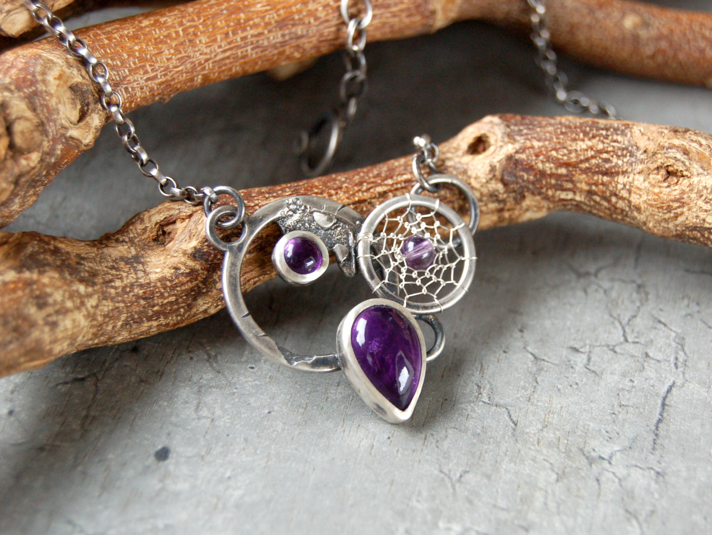 Textured silver pendant with Amethyst crystals and dreamcatchers