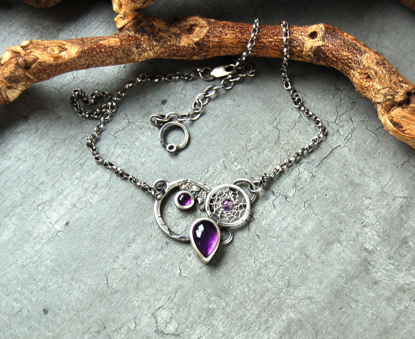 Textured silver pendant with Amethyst crystals and dreamcatchers