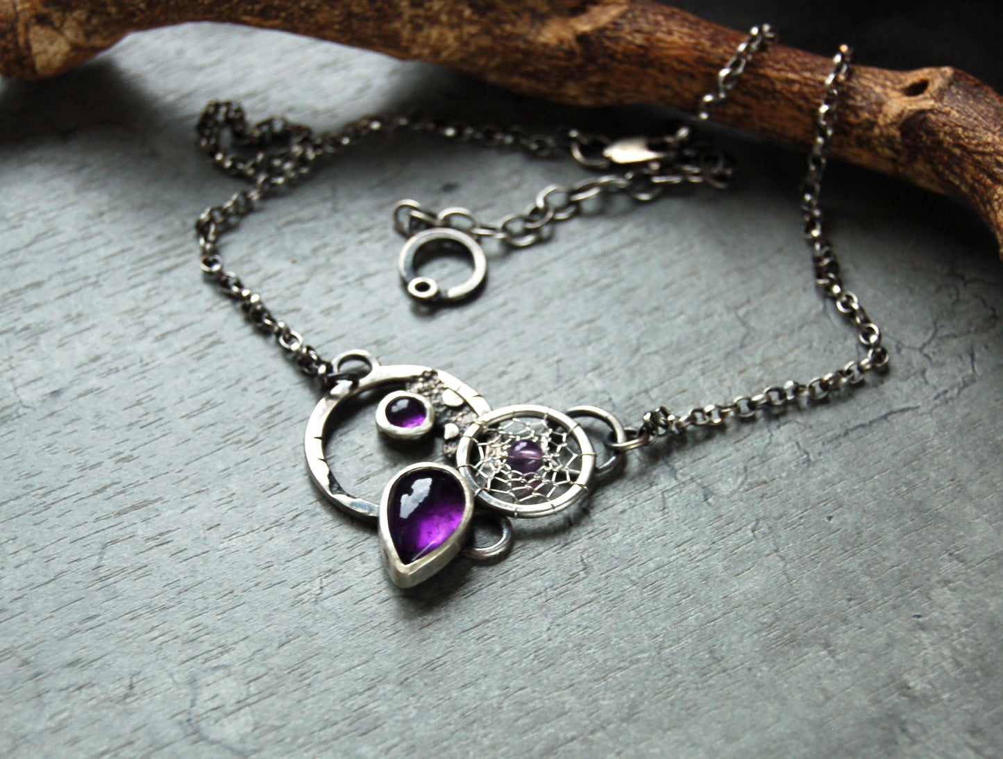 Textured silver pendant with Amethyst crystals and dreamcatchers