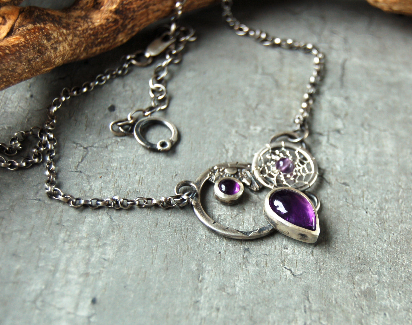 Textured silver pendant with Amethyst crystals and dreamcatchers