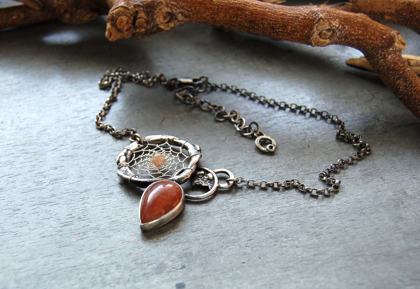 silver dream catcher necklace with sunstone gemstones and organic textures. Abstract bohemian style Pendant