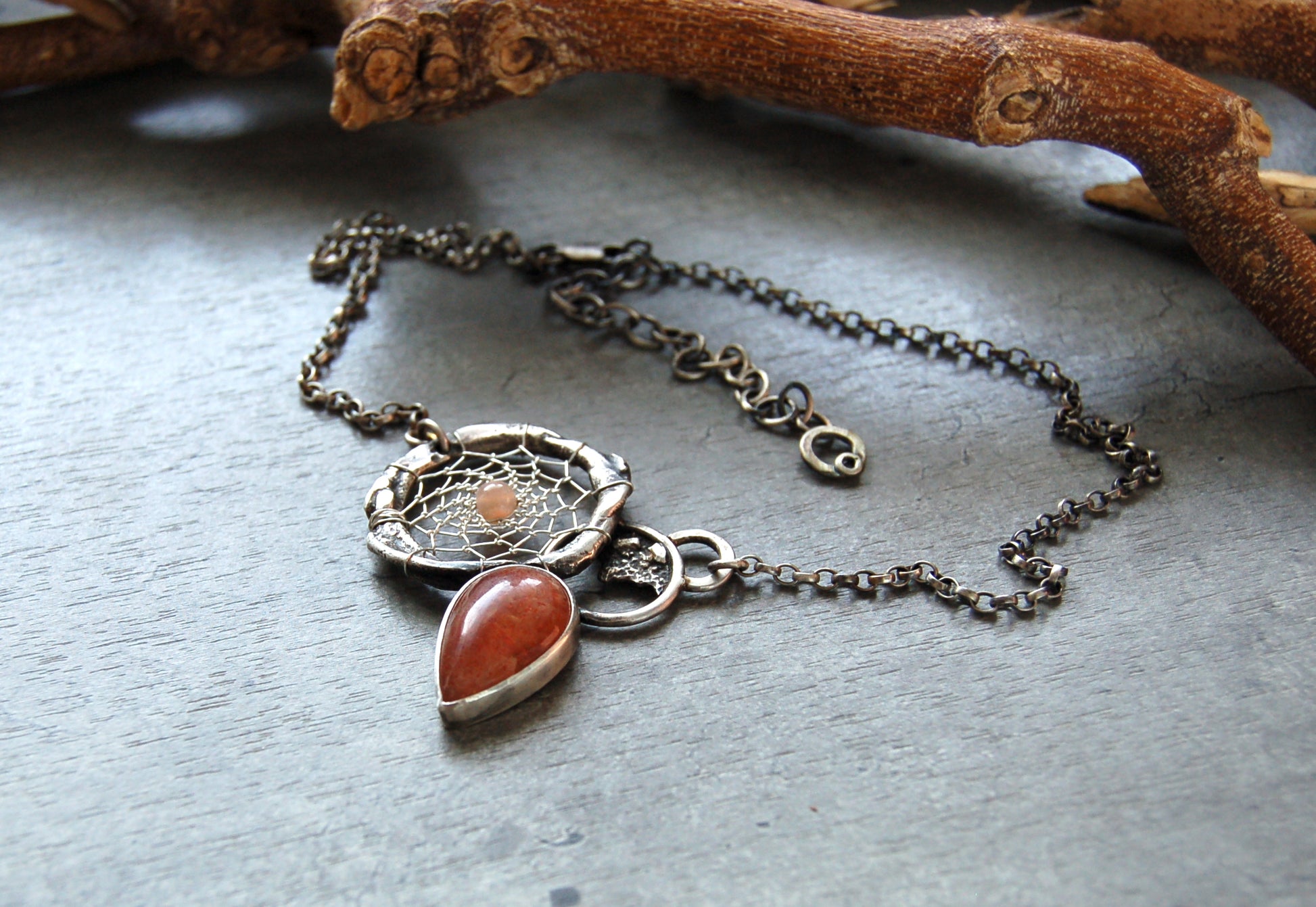 silver dream catcher necklace with sunstone gemstones and organic textures. Abstract bohemian style Pendant