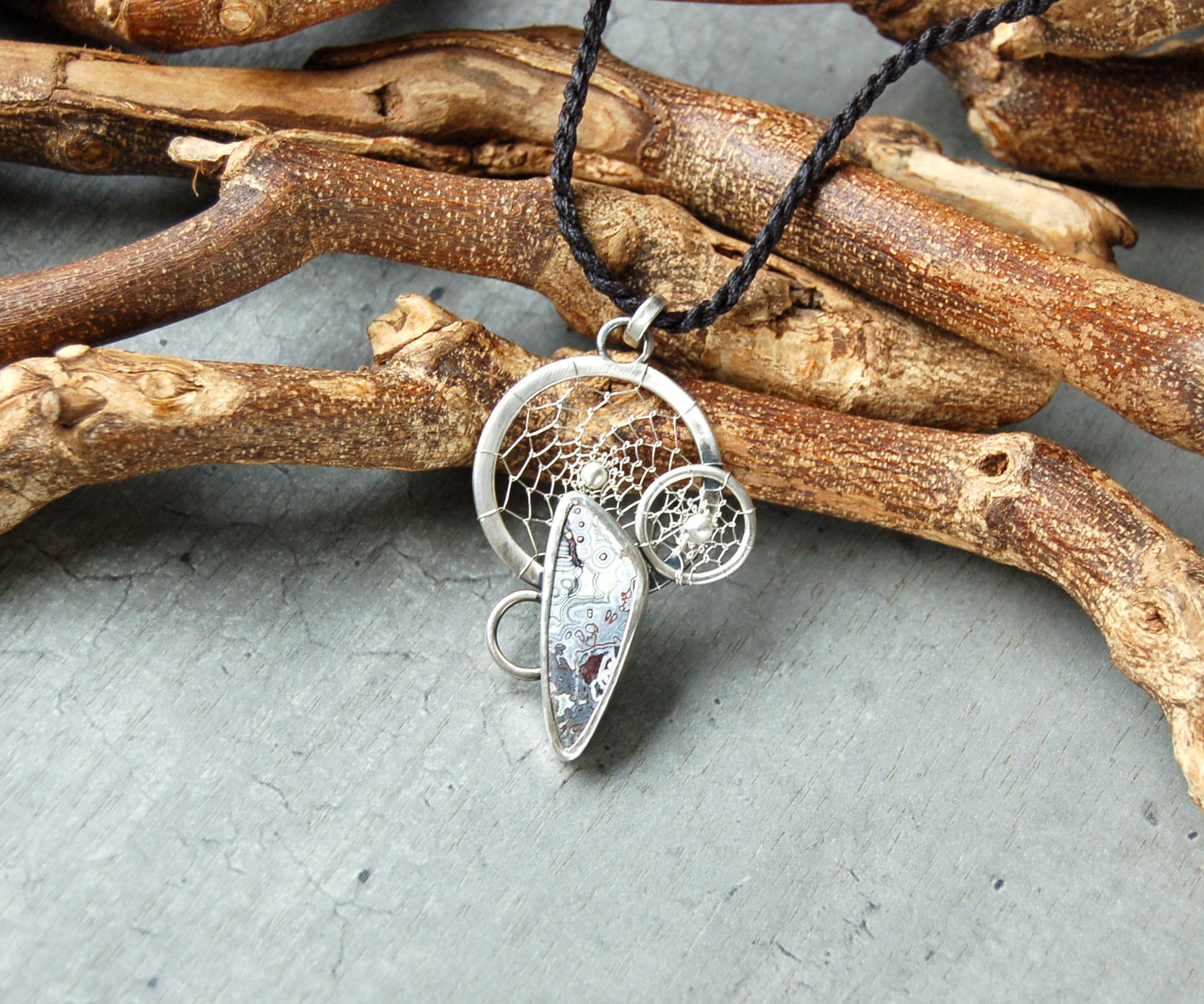Silver dreamcatcher pendant with crazy lace agate gemstone