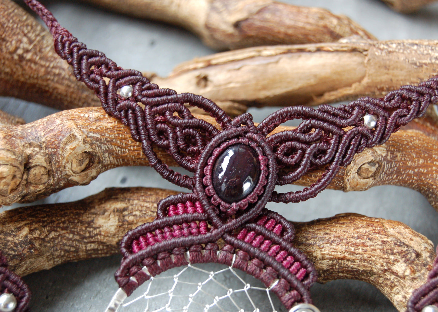 Silver wire wrapped dreamcatcher necklace with garnet gemstones