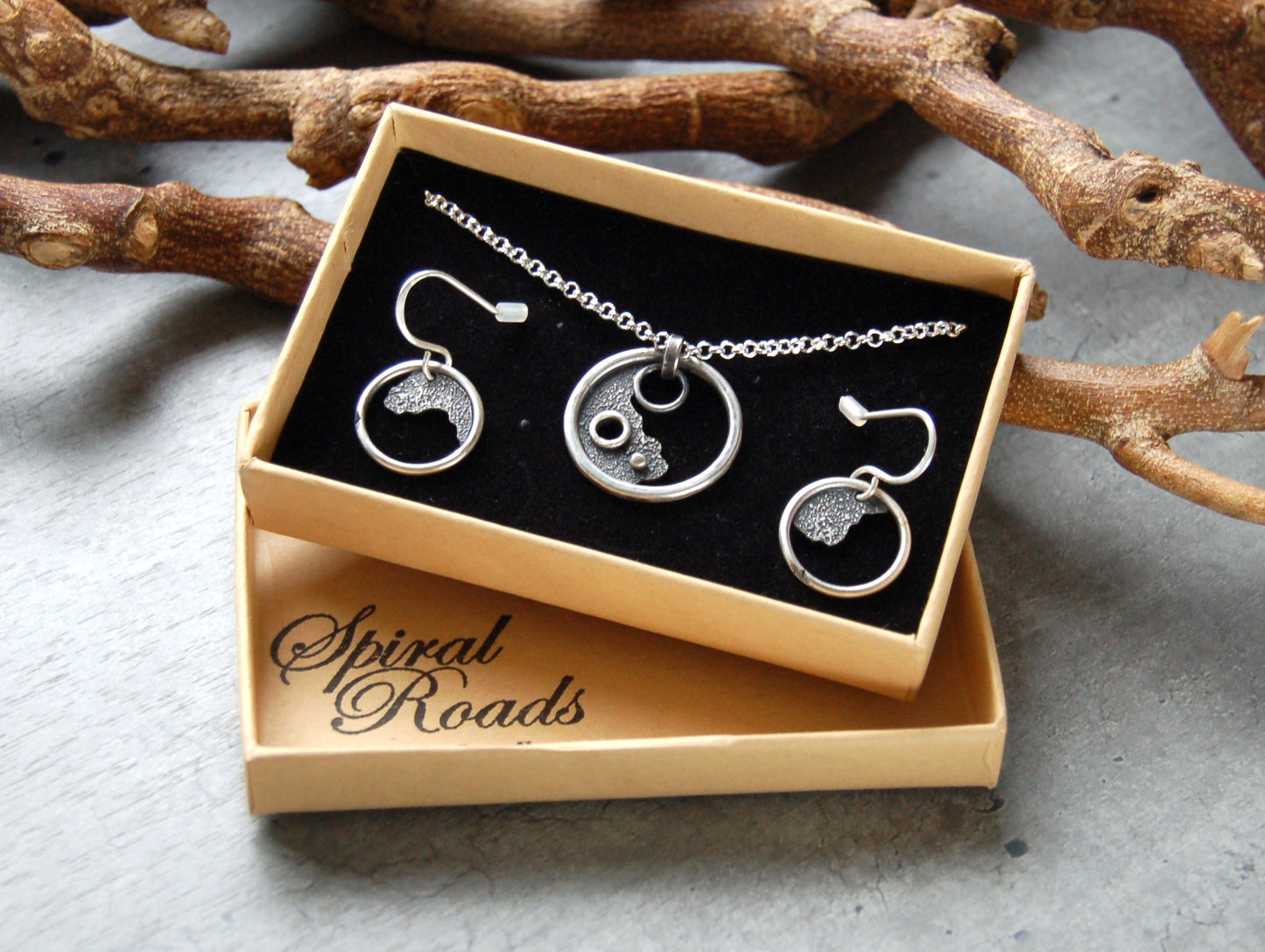 Rustic silver pendant with matching earrings