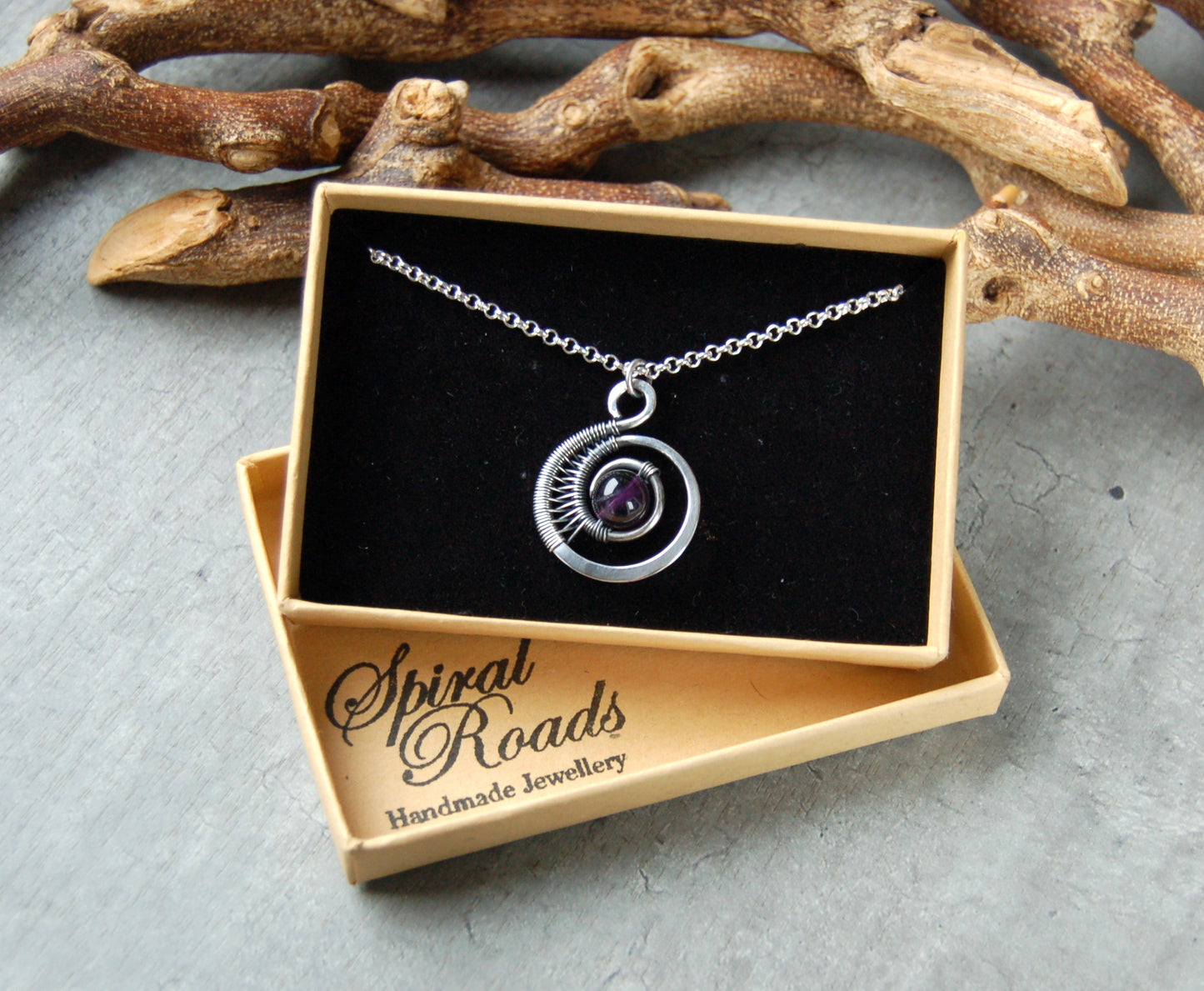 Silver wire wrapped pendant with Amethyst