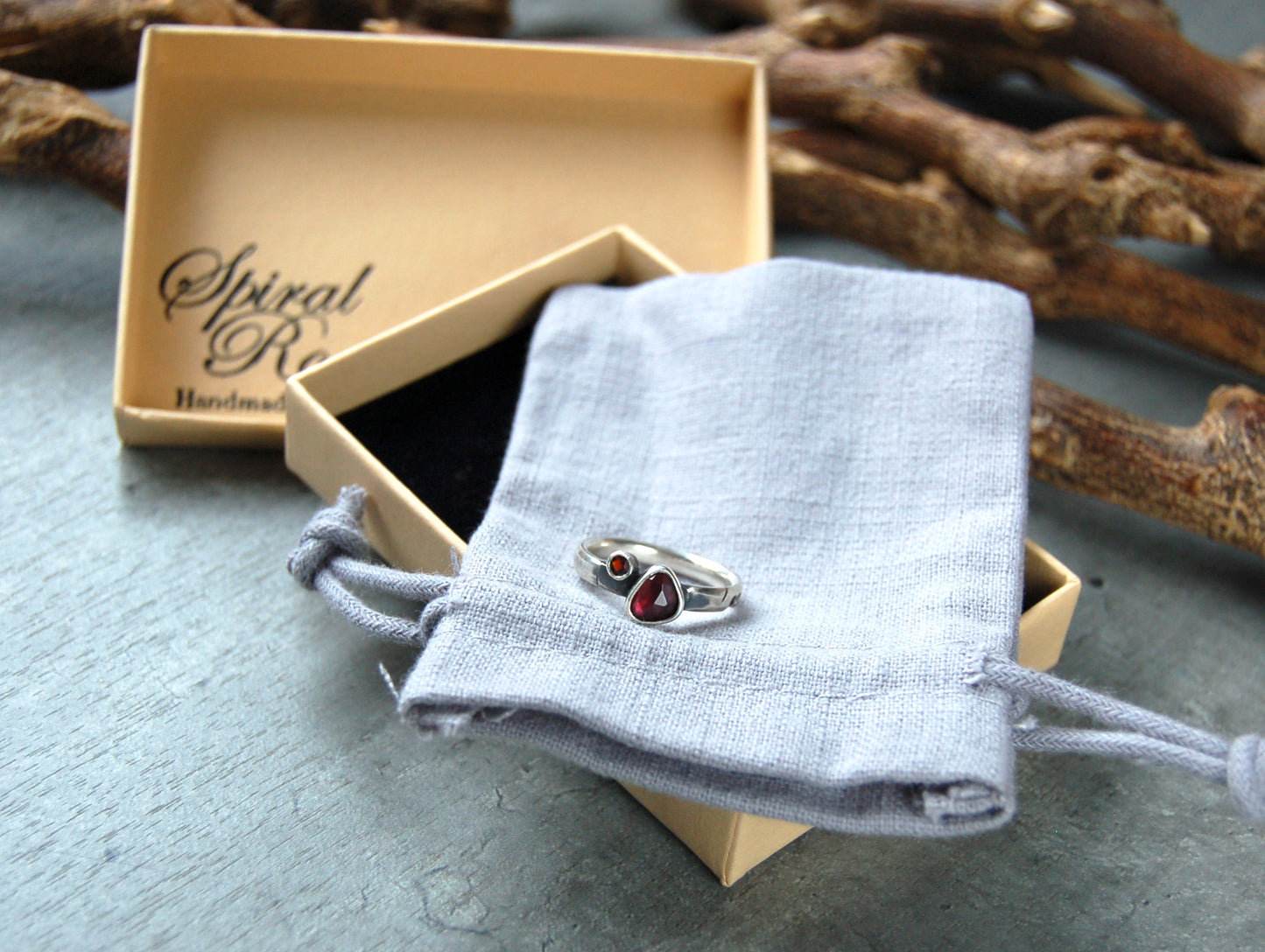 Silver stacking ring with red garnet gemstones