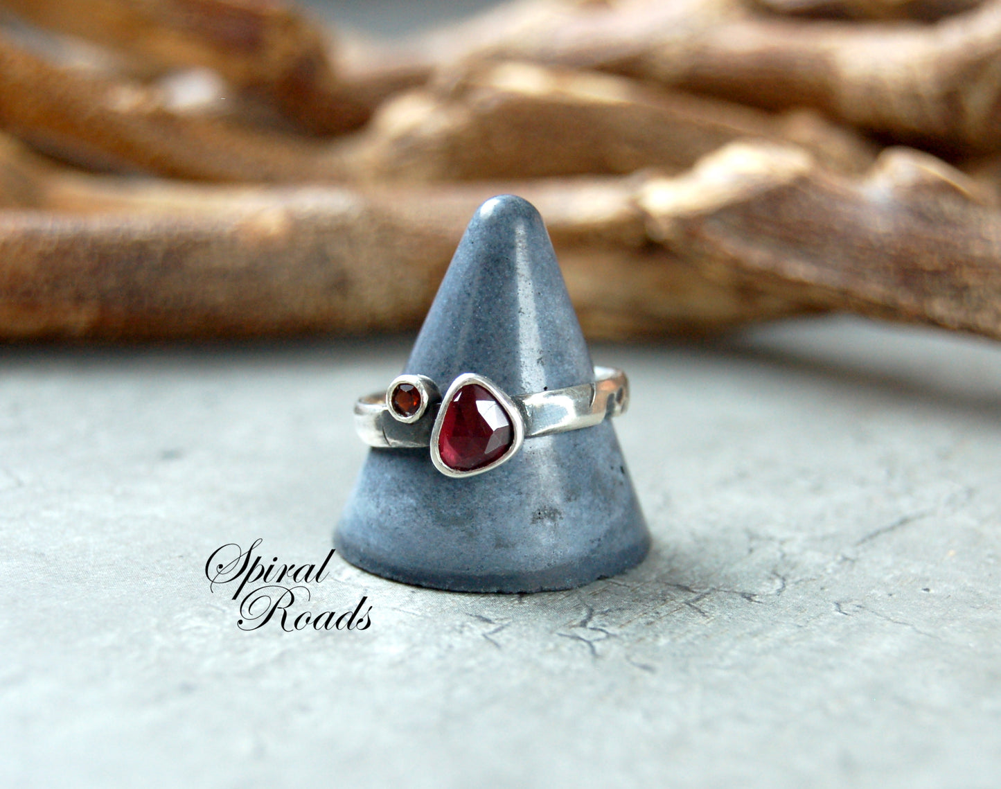 Silver stacking ring with red garnet gemstones