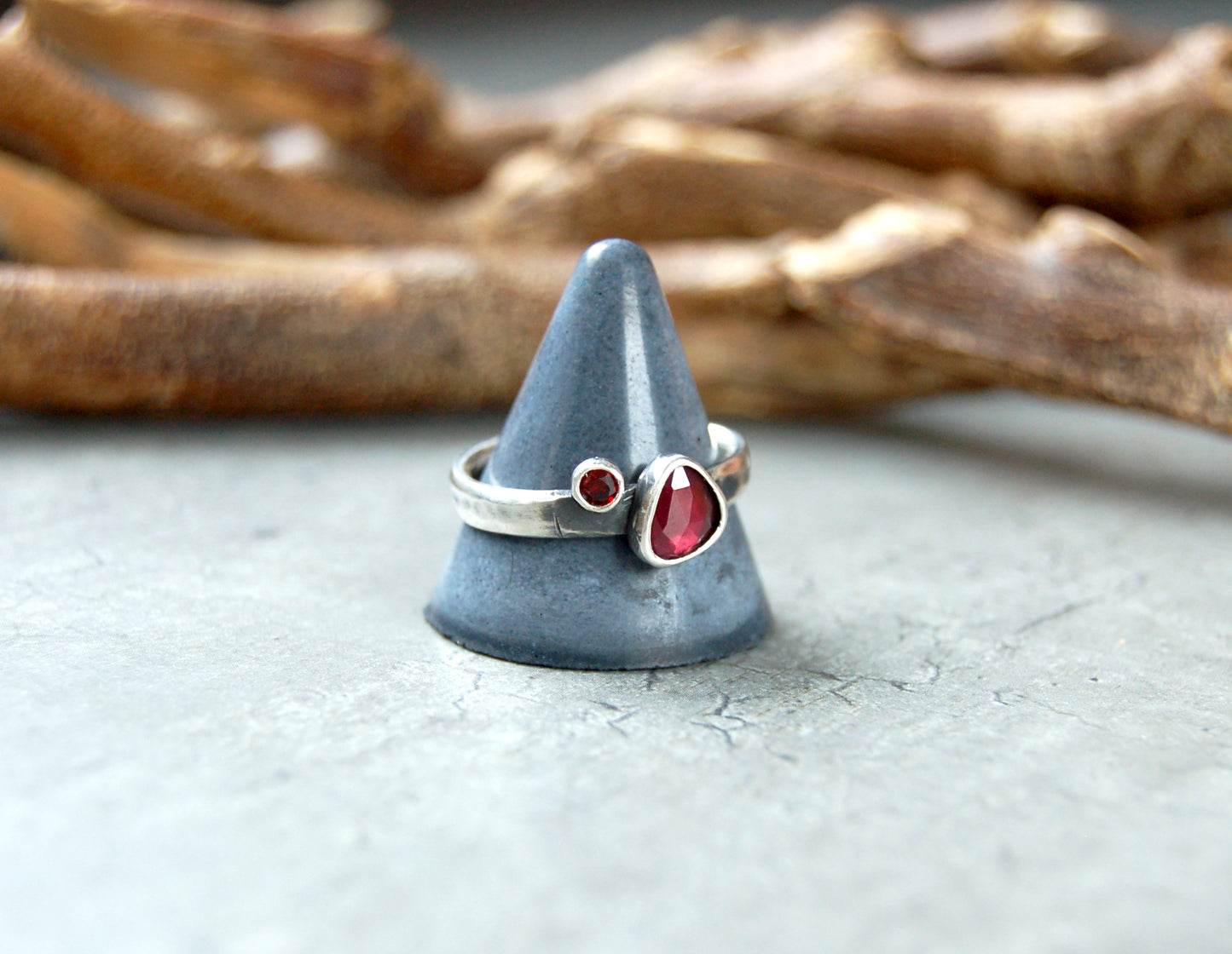 Silver stacking ring with red garnet gemstones