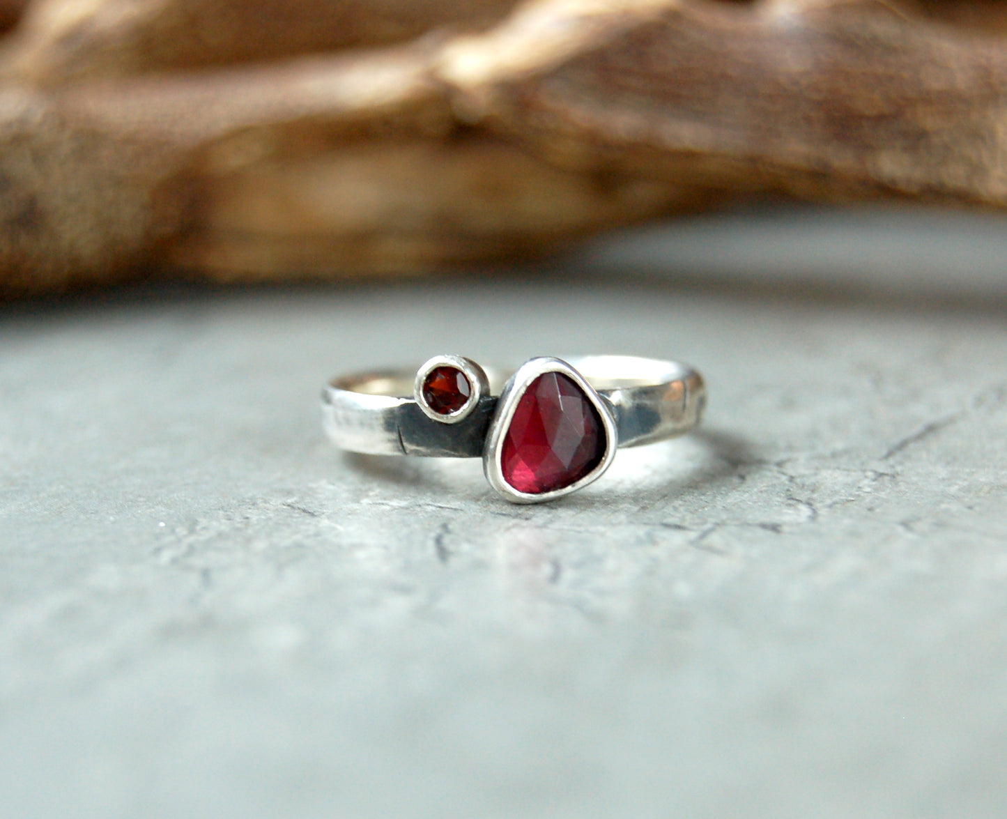 Silver stacking ring with red garnet gemstones