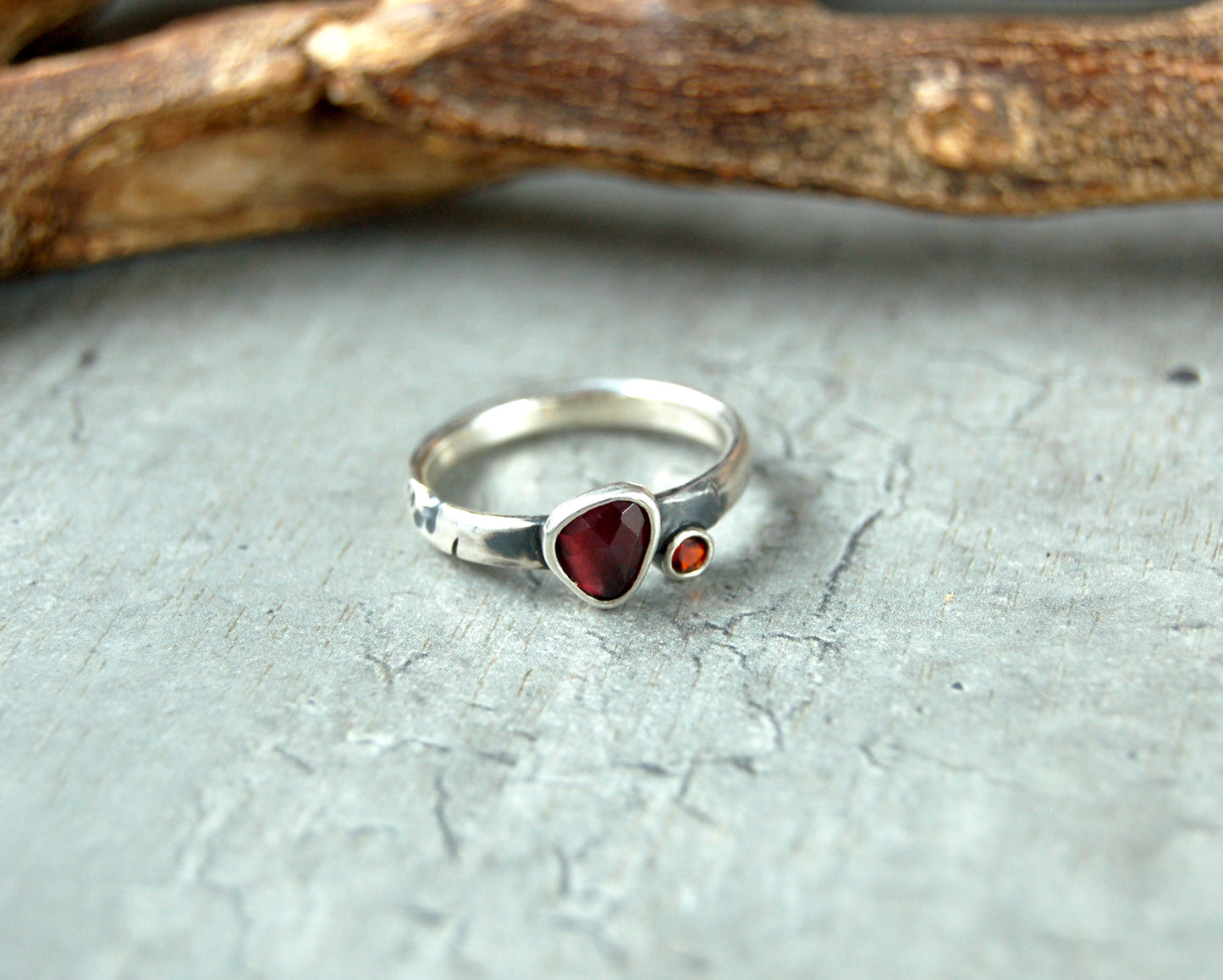 Silver stacking ring with red garnet gemstones