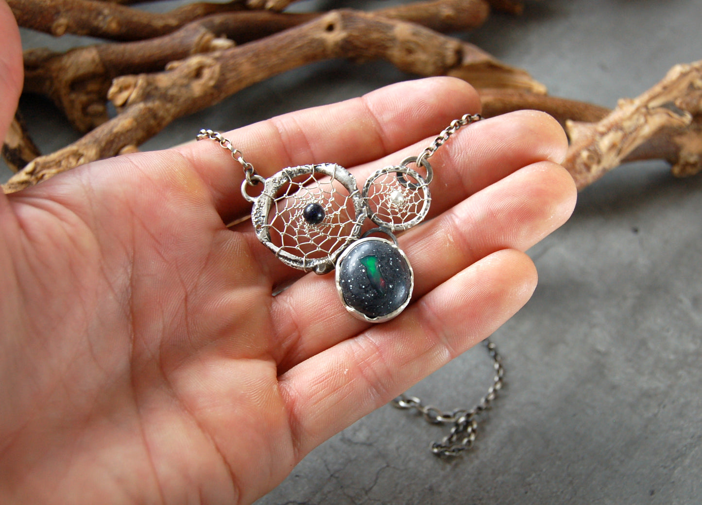 Boho style dream catcher pendant with boulder opal. Textured sterling silver necklace