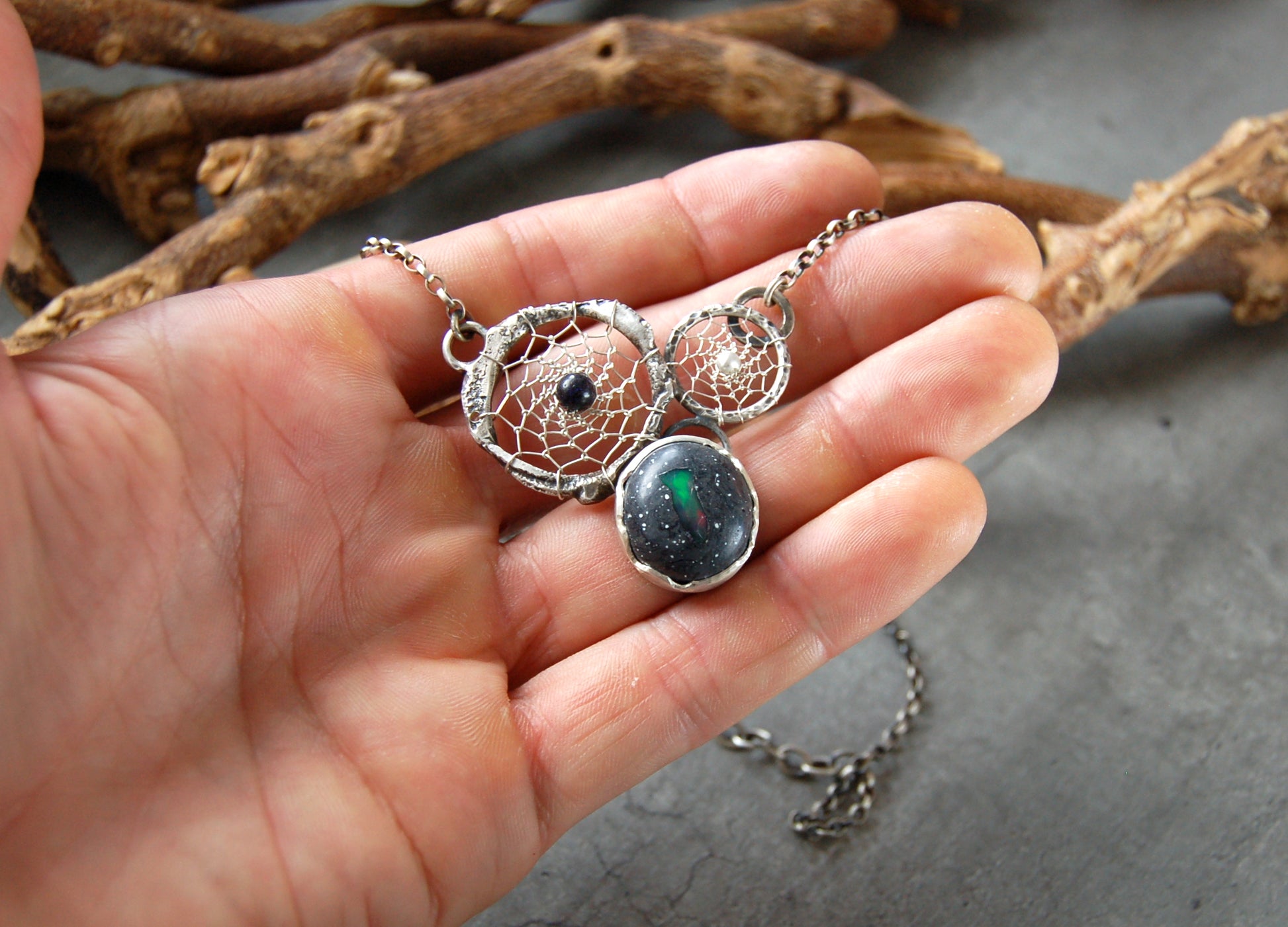 Boho style dream catcher pendant with boulder opal. Textured sterling silver necklace