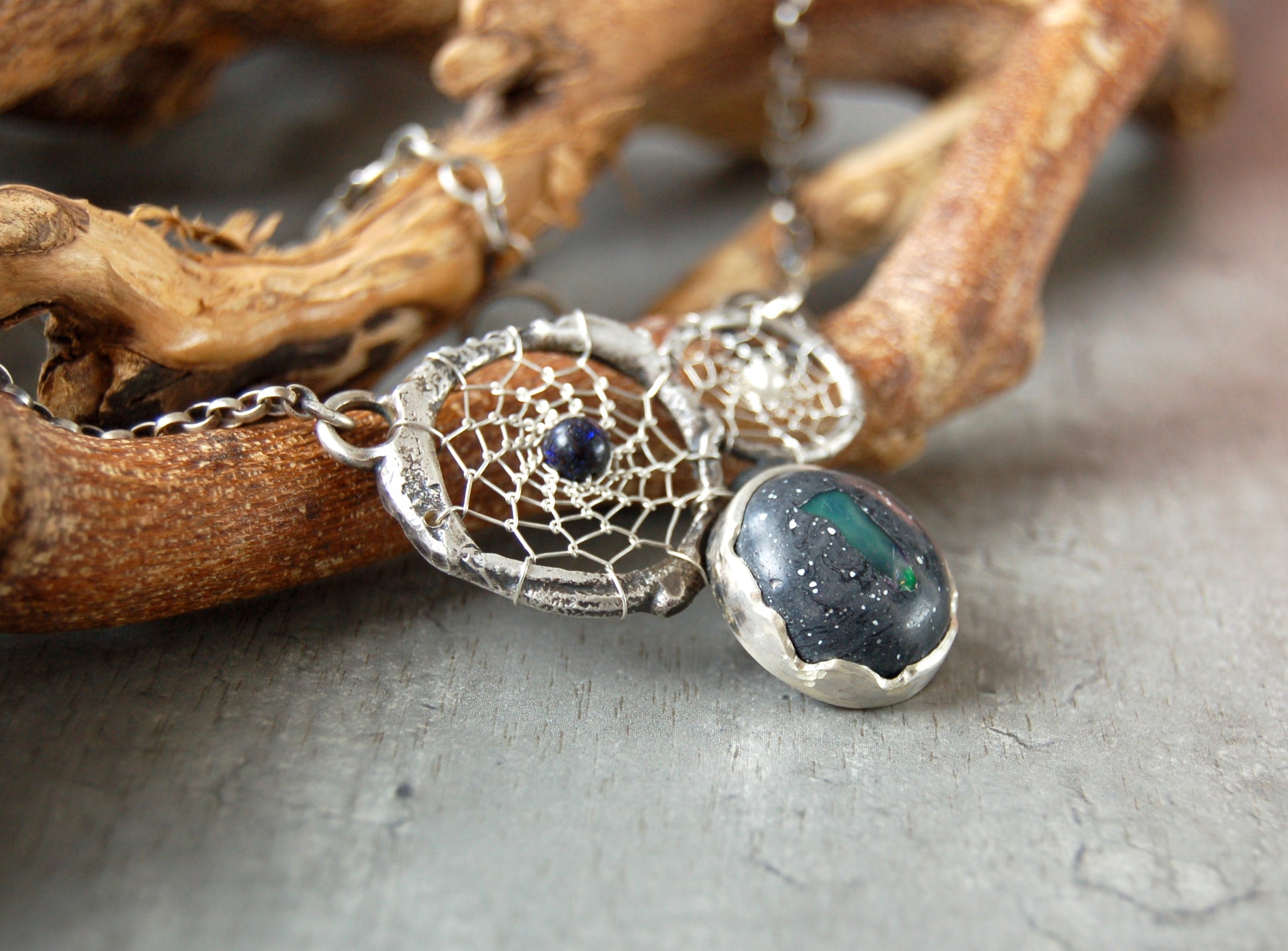 Boho style dream catcher pendant with boulder opal. Textured sterling silver necklace