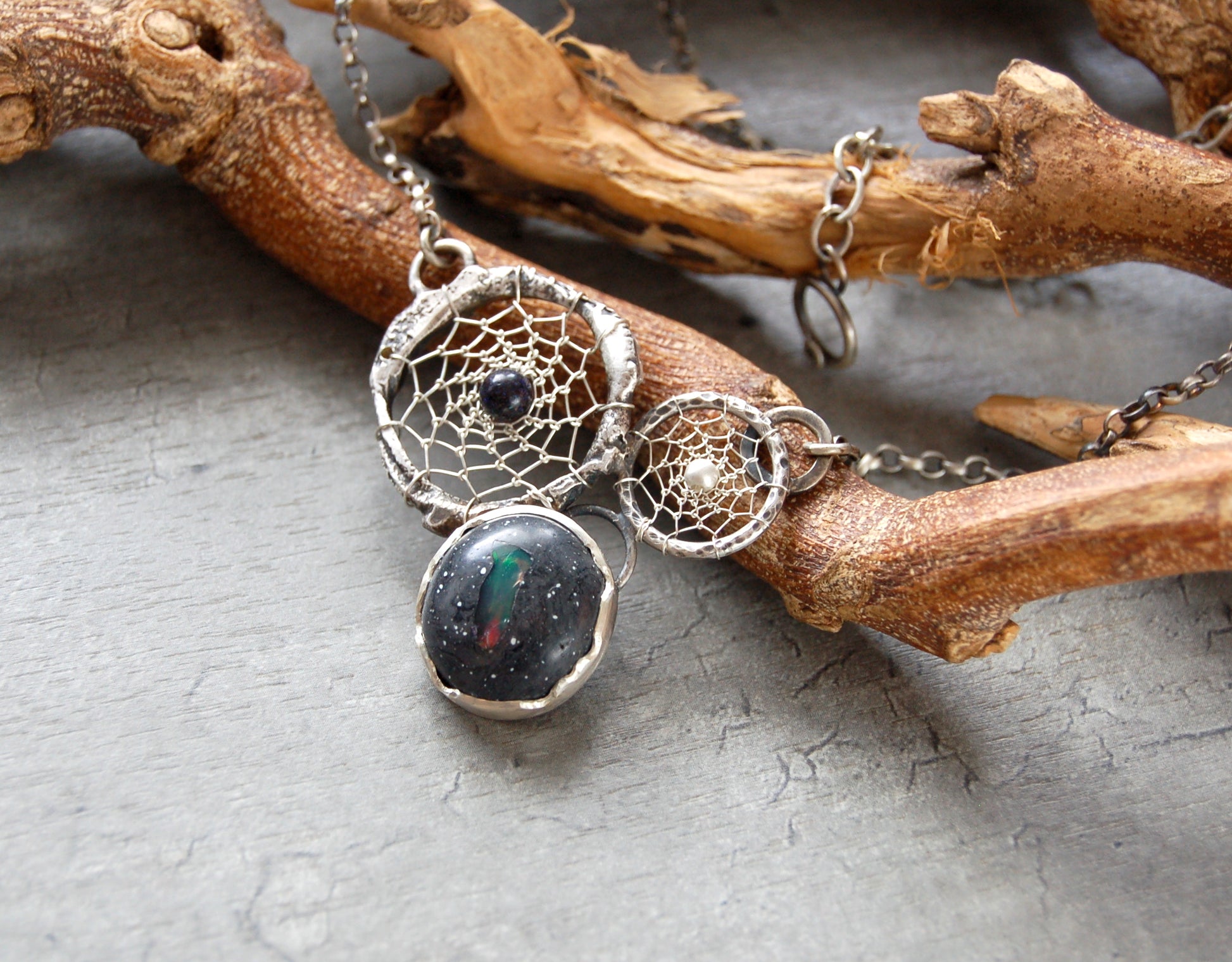Boho style dream catcher pendant with boulder opal. Textured sterling silver necklace