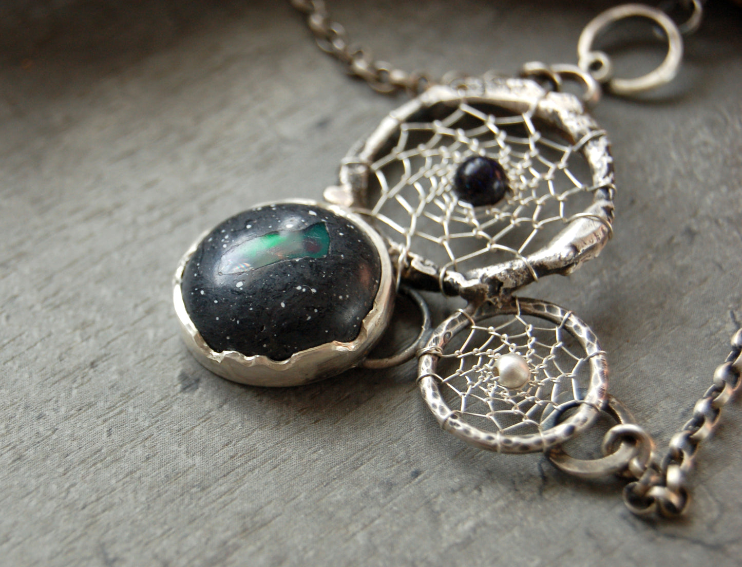 Boho style dream catcher pendant with boulder opal. Textured sterling silver necklace