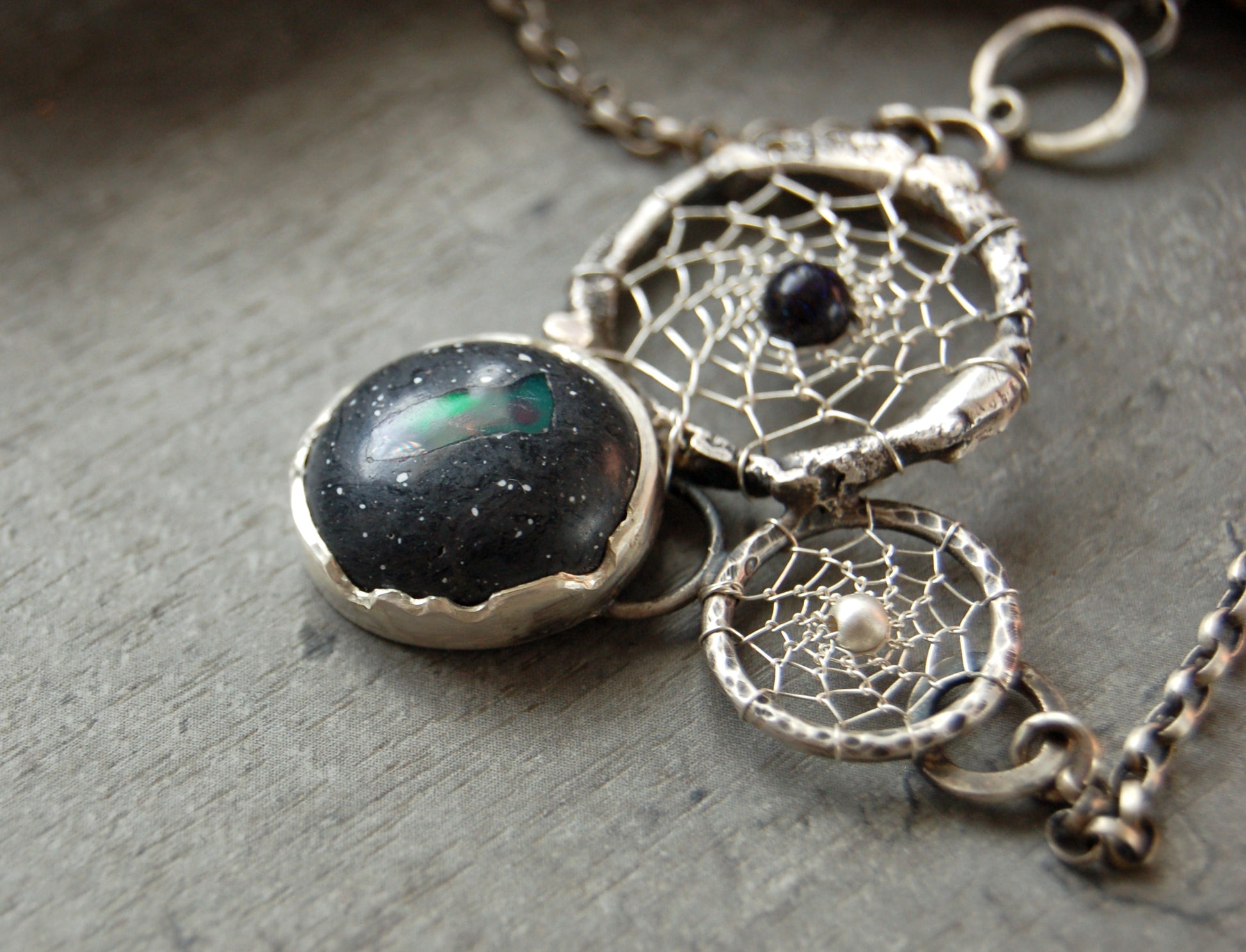 Boho style dream catcher pendant with boulder opal. Textured sterling silver necklace