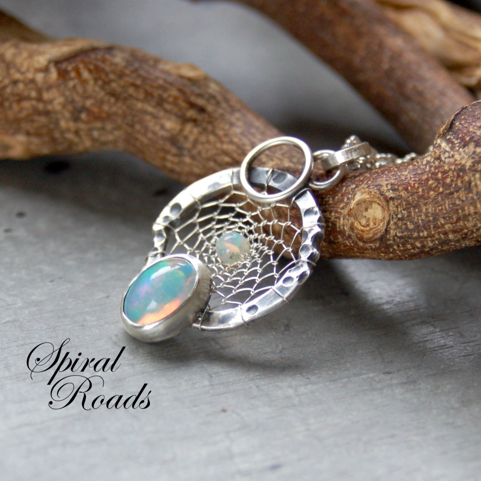 Opal gemstone pendant. Silver dreamcatcher necklace on a chain