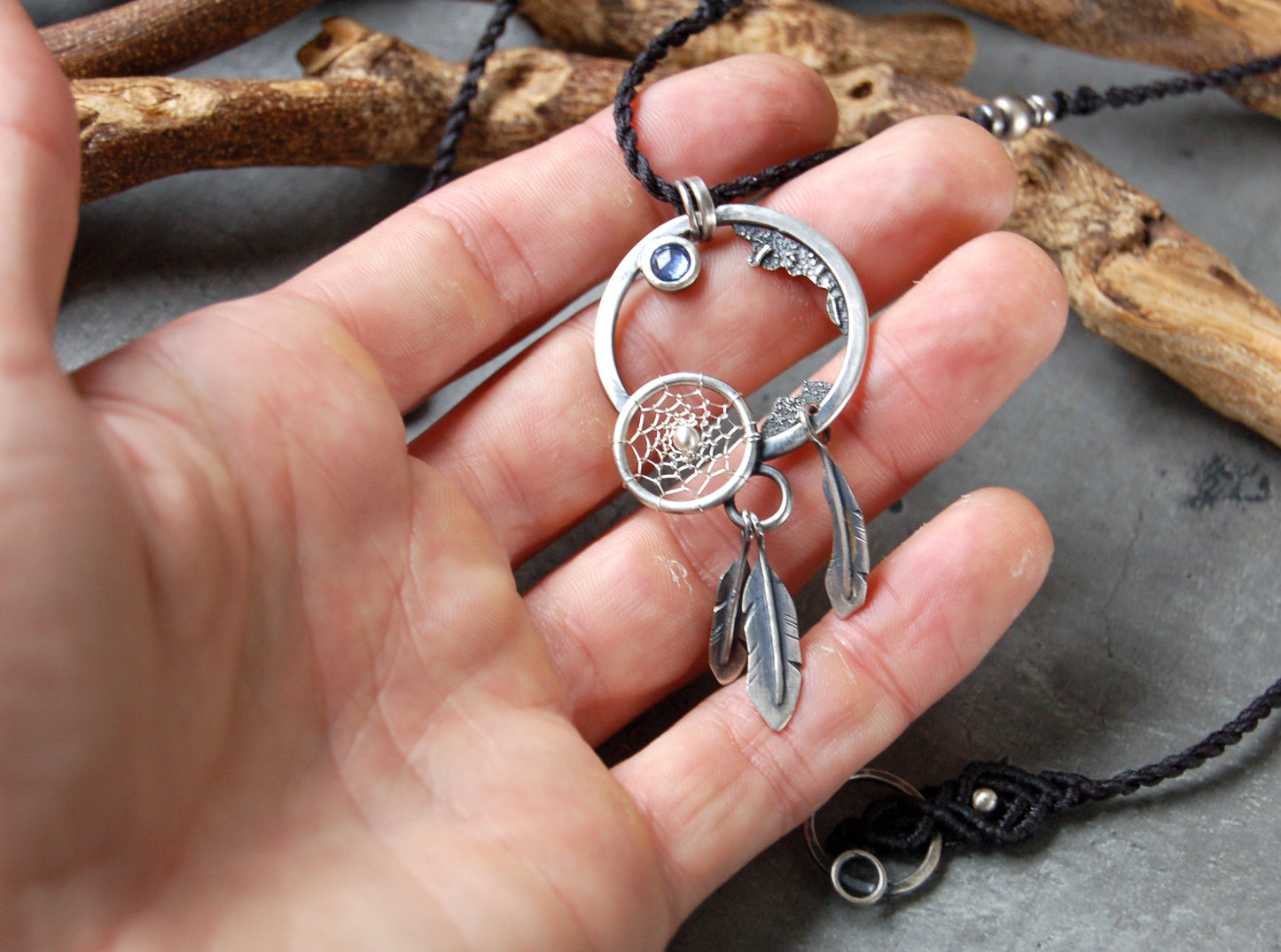 Dystopian necklace with dreamcatcher and sapphire