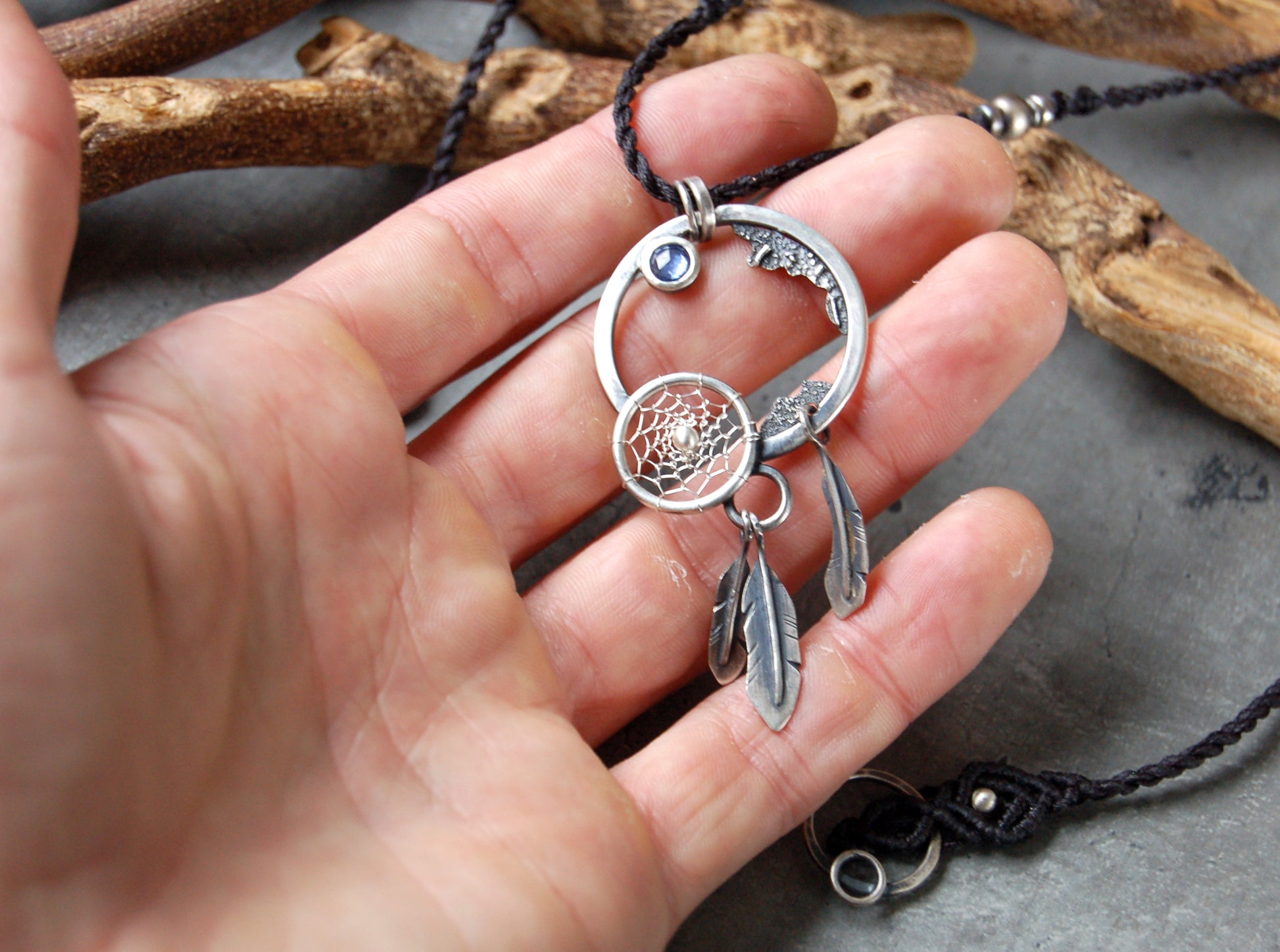 Dystopian necklace with dreamcatcher and sapphire